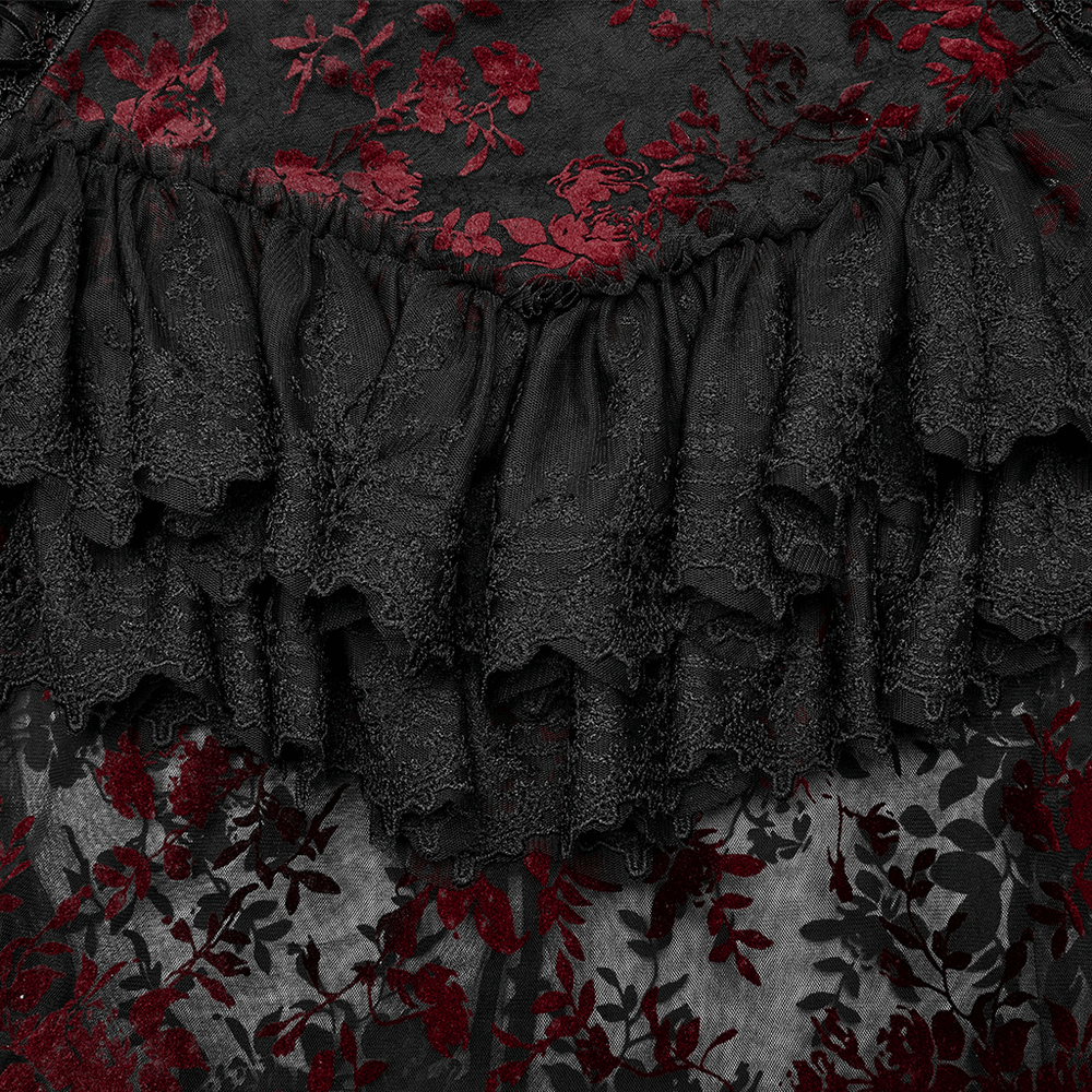 Close-up of a floral gothic layered lace skirt featuring intricate red and black lace detailing.
