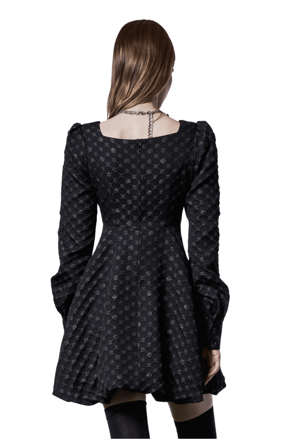 Back view of a Floral Jacquard Square-Neck Dress with padded sleeves and playful pleats, showcasing pearl details.