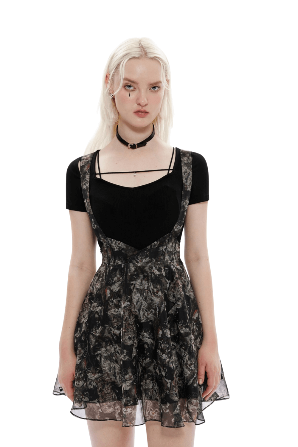 Floral print A-line skirt with cat-ear detail and criss-cross straps, perfect for playful yet stylish outfits.