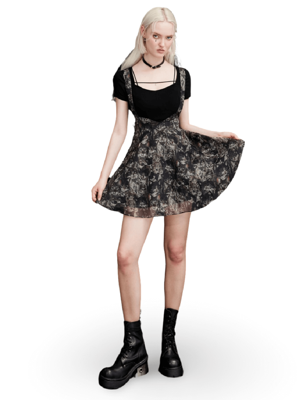 Floral print A-line skirt with cat-ear detail, worn by a model in a stylish outfit with platform boots.