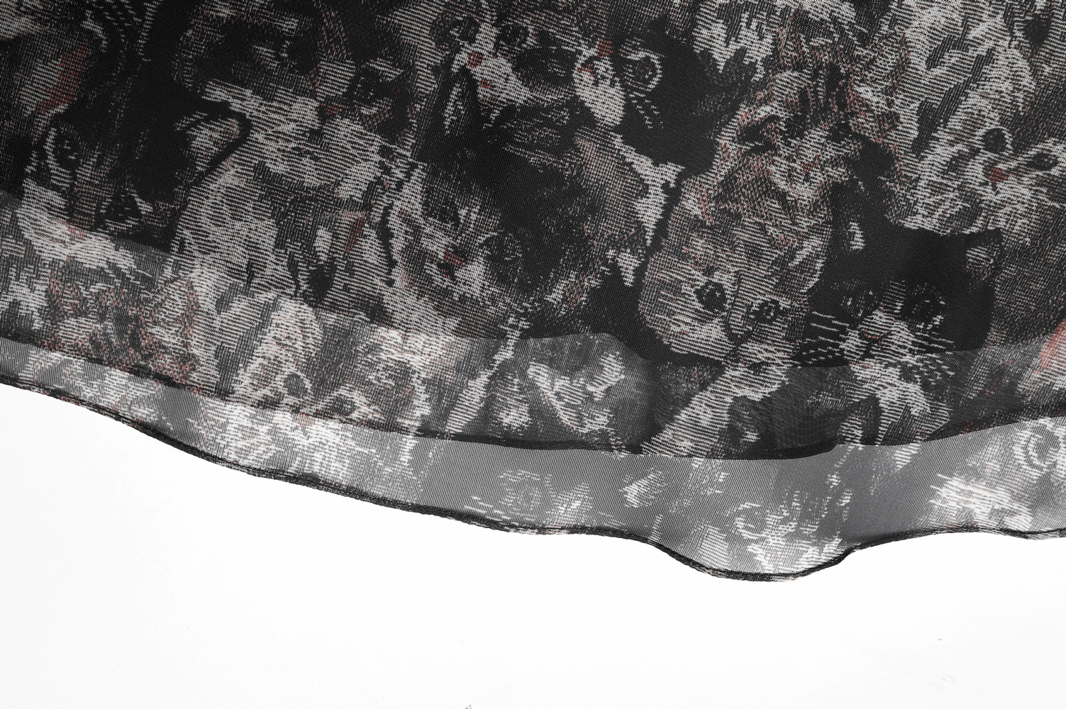 Close-up of floral cat-ear A-line skirt hem showcasing playful cat print and delicate chiffon texture.