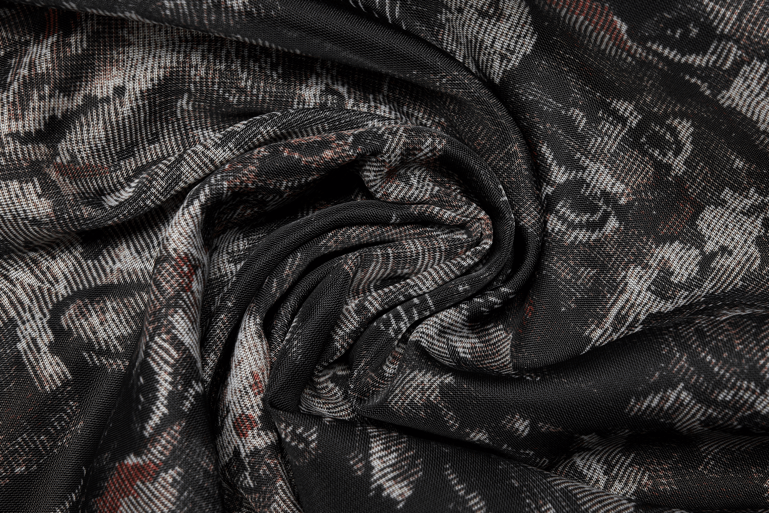 Close-up of soft fabric in floral print with black, gray, and red colors, perfect for stylish skirts and dresses.