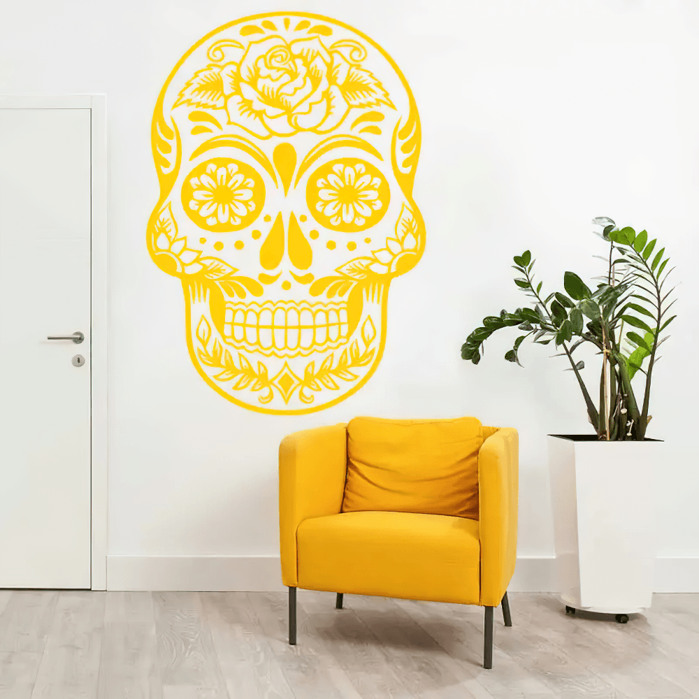 Floral Sugar Skull Vinyl Wall Sticker for Gothic Decor on white wall with yellow accent chair and plant.