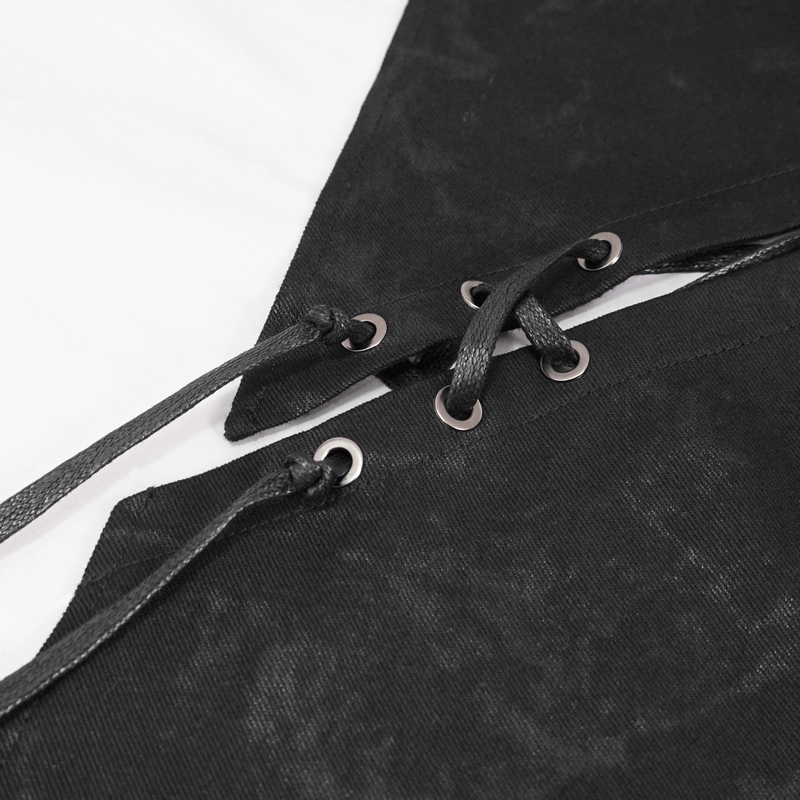 Close-up of decorative lacing on a black kilt, showcasing stylish metal eyelets and quality fabric.