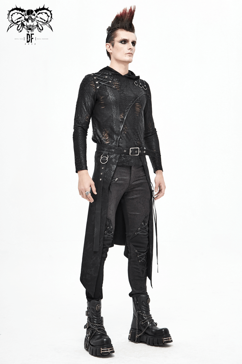 Stylish man in a black edgy outfit with decorative lacing, showcasing punk fashion and unique accessories.