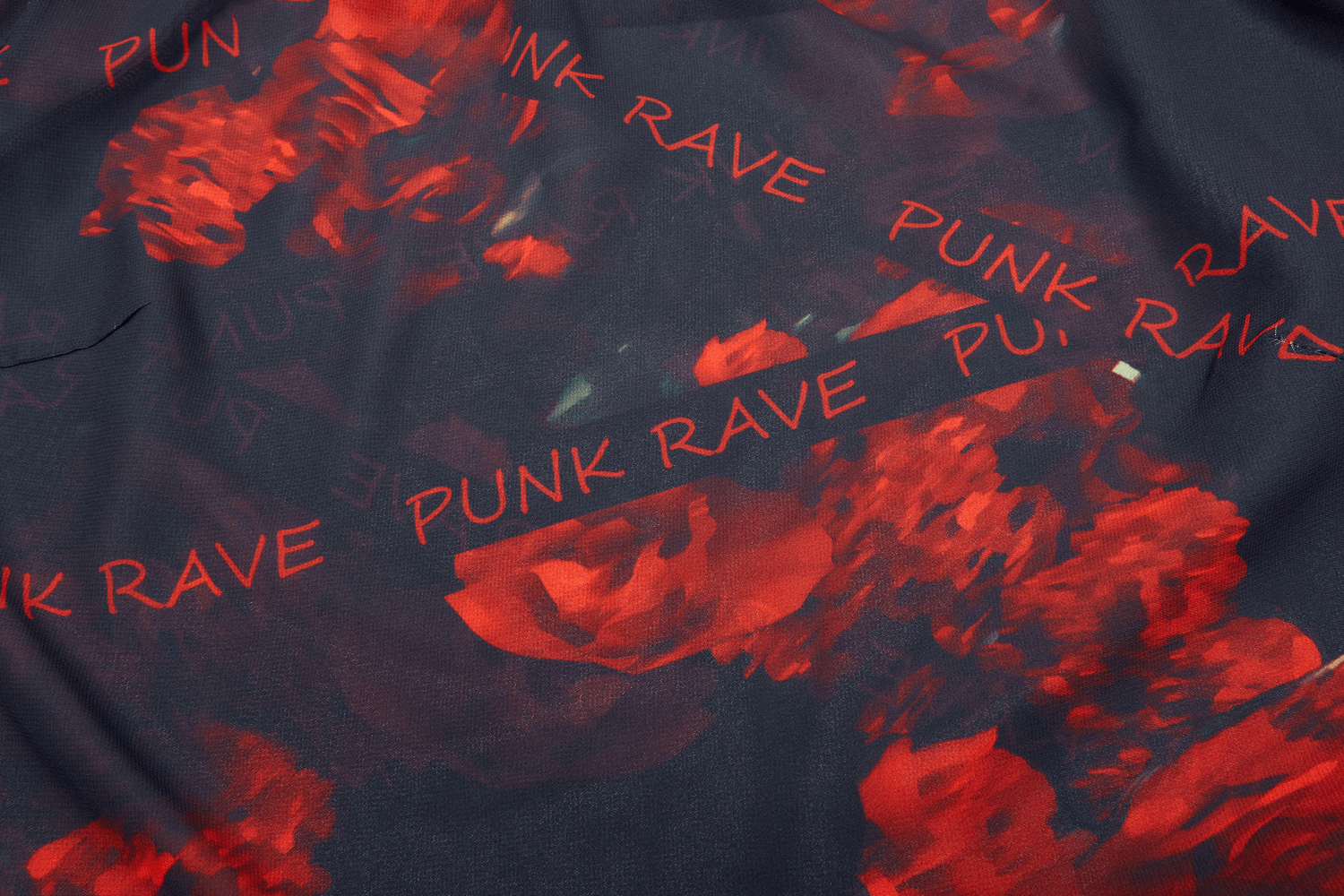 Close-up of dark floral fabric with 'Punk Rave' text, perfect for a stylish layered skirt.