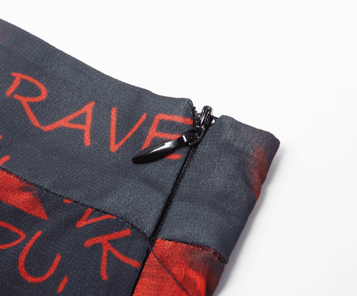 Close-up of zipper detail on a dark floral skirt from Punk Rave, showcasing bold red lettering.