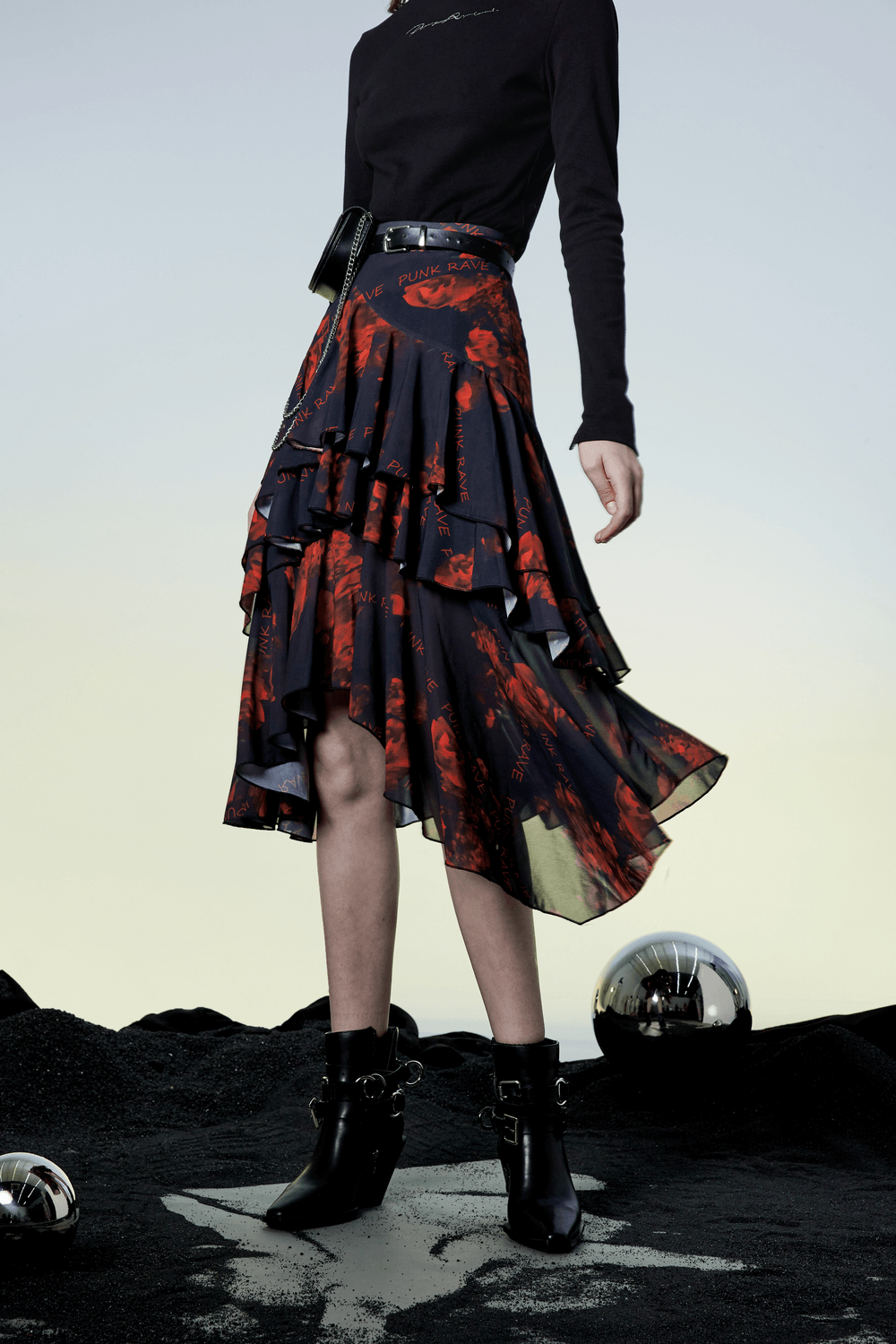 Model wears a flowy high-low floral layered skirt from Punk Rave, showcasing a dynamic and edgy design.
