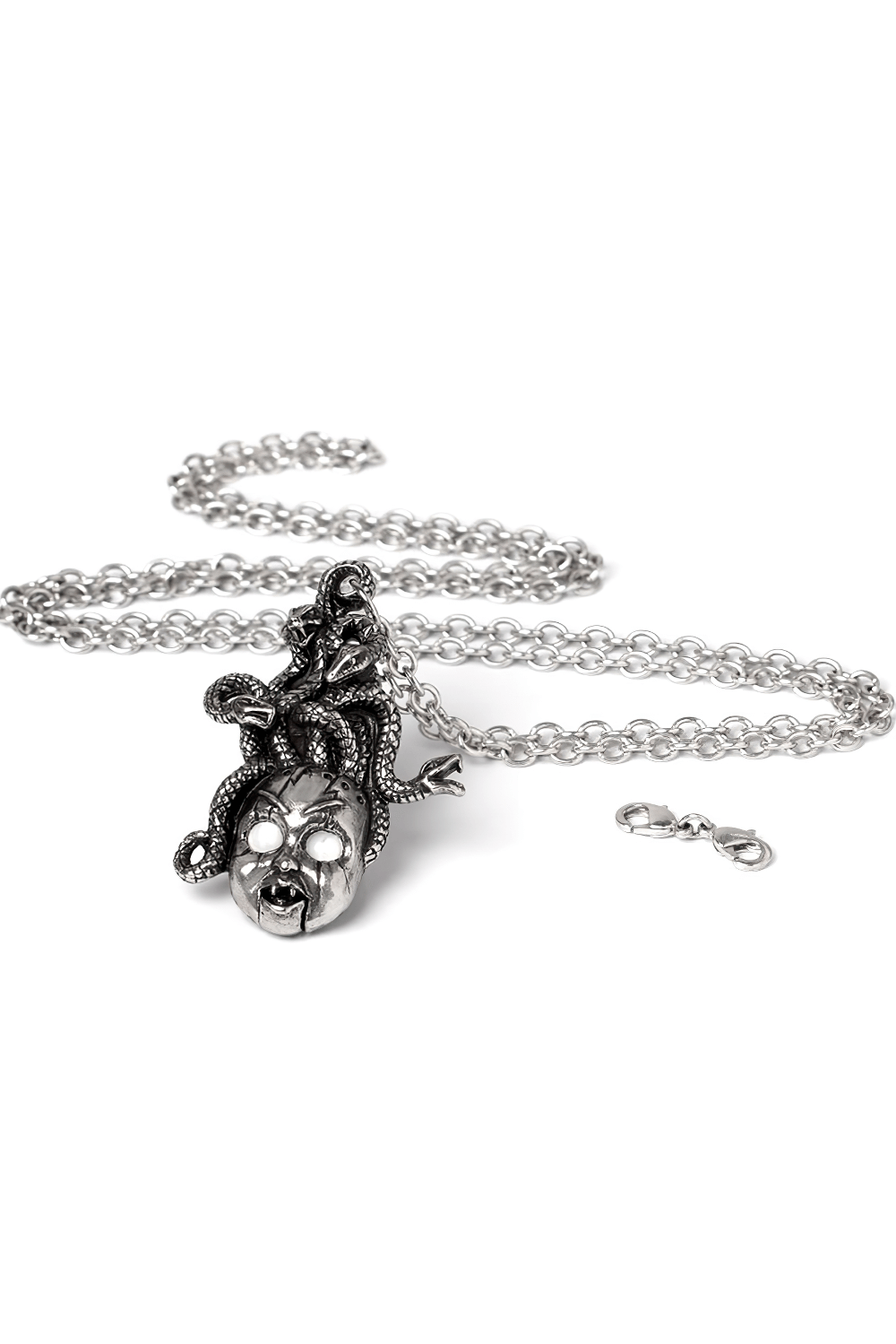 Frightening doll's head pendant with serpent hair and mother-of-pearl eyes on a silver chain necklace.