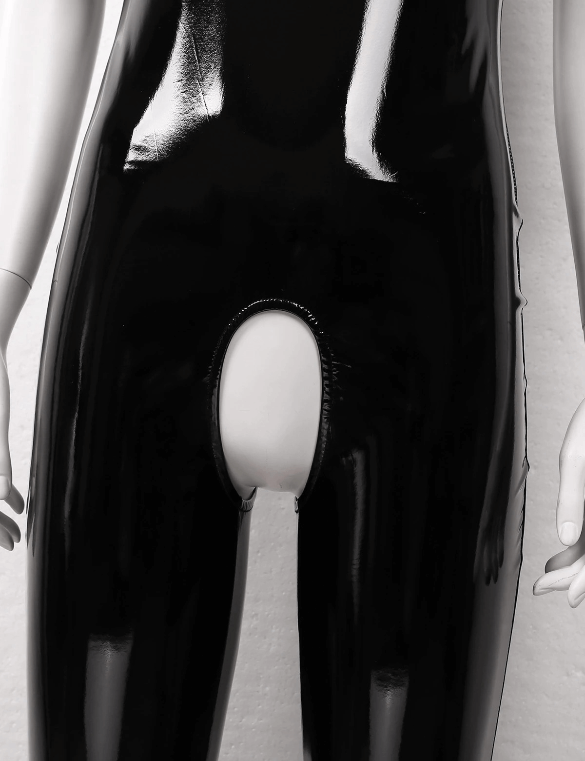 Close-up of a women's black wet look crotchless catsuit, showcasing a sleek patent leather design.