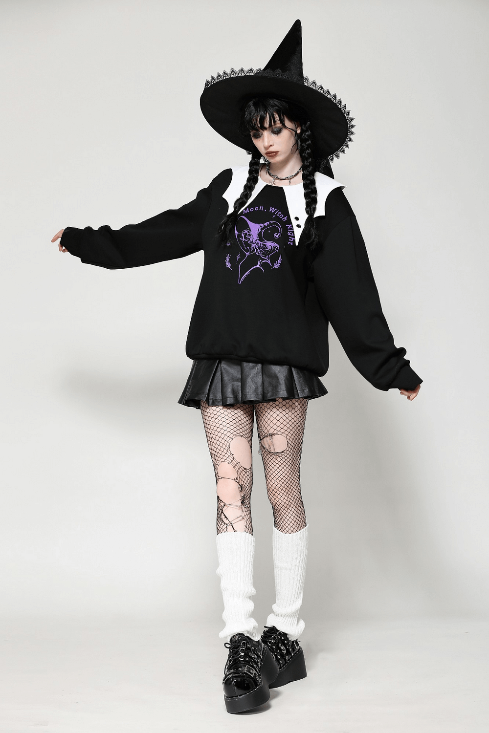 Gothic model wearing Full Moon Witch sweatshirt with contrast collar, styled with a witch hat and edgy skirt.