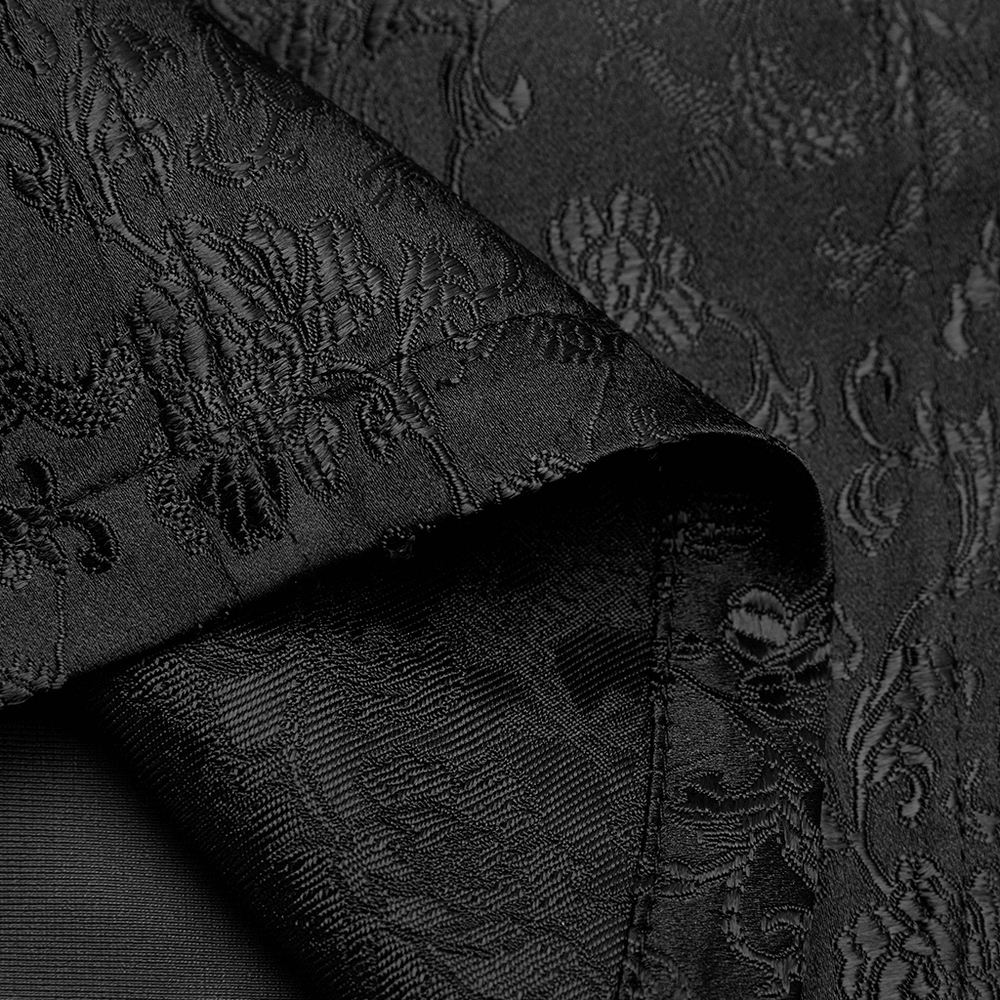Close-up of black jacquard fabric with intricate dragon pattern, perfect for a cyberpunk-inspired dress.