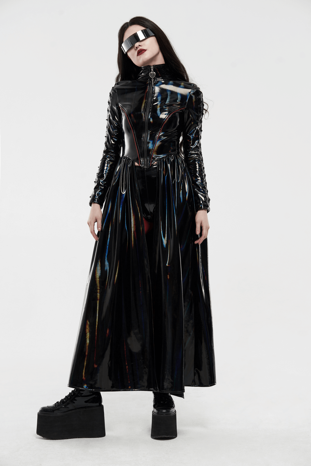 Futuristic high-shine laser-cut long coat for women, featuring a sleek design and reflective fabric, perfect for avant-garde fashion.