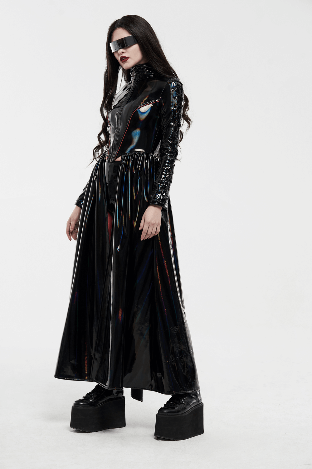 Futuristic high-shine laser-cut long coat for women with avant-garde design and stylish visor.