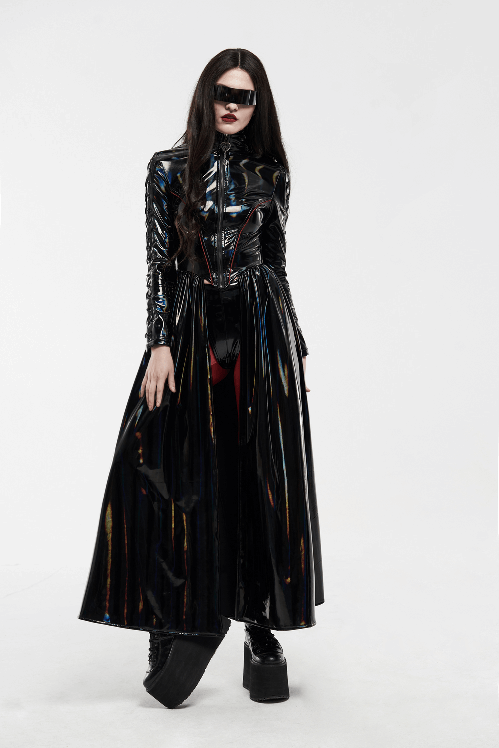Futuristic high-shine laser-cut long coat for women, featuring a sleek design and striking black finish.