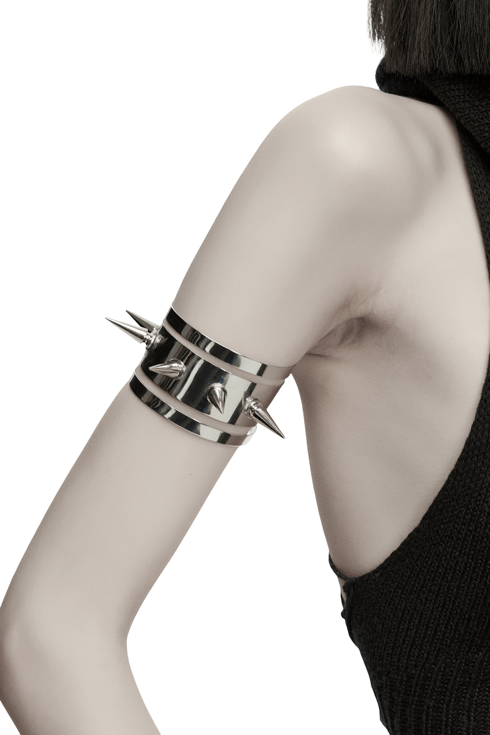 Futuristic Punk Spiked Arm Cuff with Mirror Finish showcased on a model's arm, highlighting its bold spikes and shiny design.