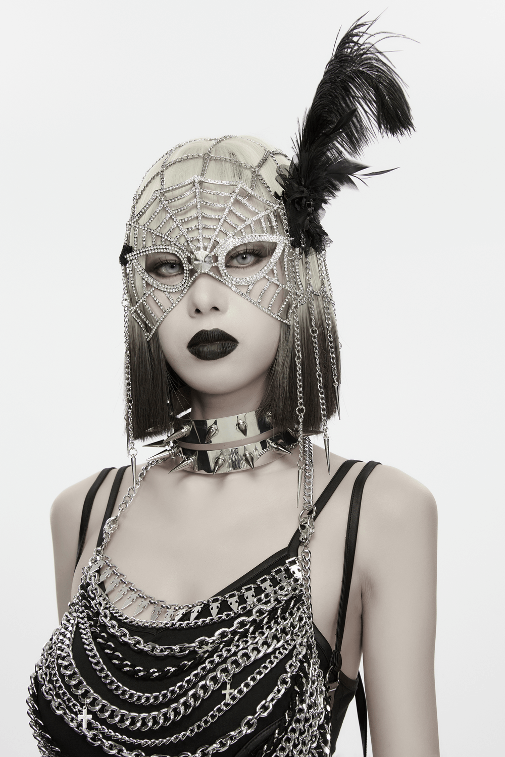 Futuristic Punk Studded Choker with Metal Spikes worn with a dramatic spiderweb mask and edgy chain outfit.