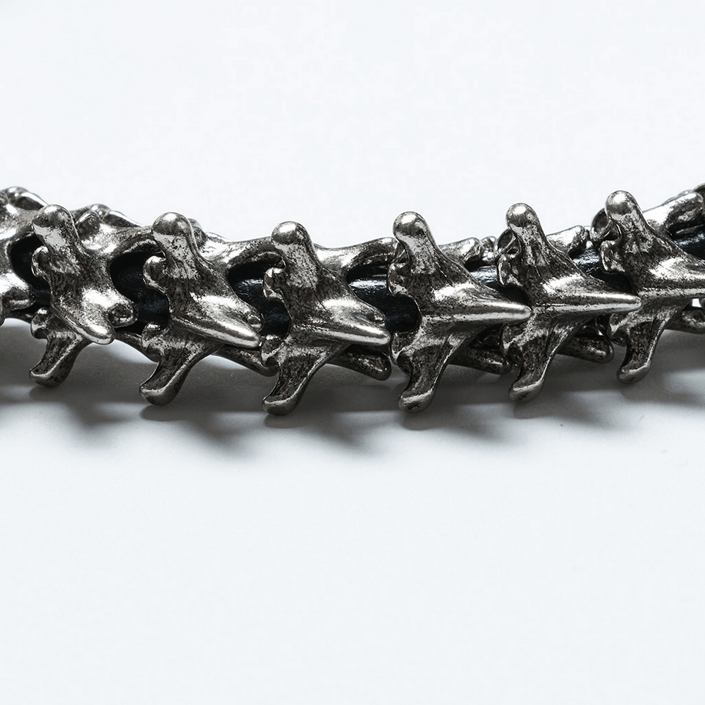 Close-up of a metallic spine choker showcasing punk and retro aesthetic with magnetic buckle for easy wear.