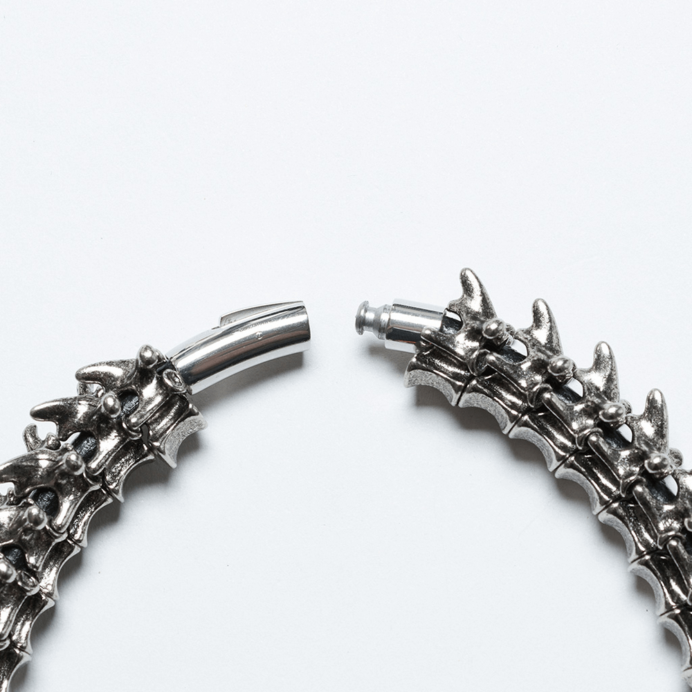 Futuristic spine choker featuring alloy skeleton design and magnetic closure for easy wear.
