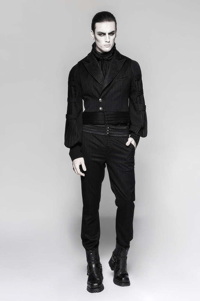 Stylish model in black striped pants and elegant jacket, embracing a steampunk gothic aesthetic.