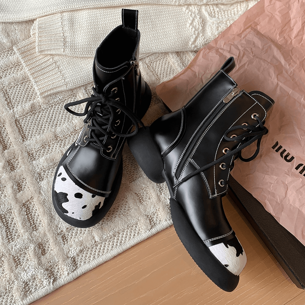 Genuine leather ankle boots for women with cow print, round toe, and lace-up design for a chic fashion statement.