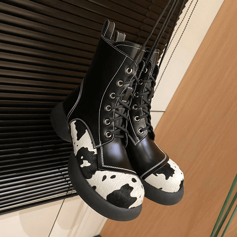Genuine leather ankle boots for women in stylish cow print with round toe and lace-up design, perfect for casual chic outfits.