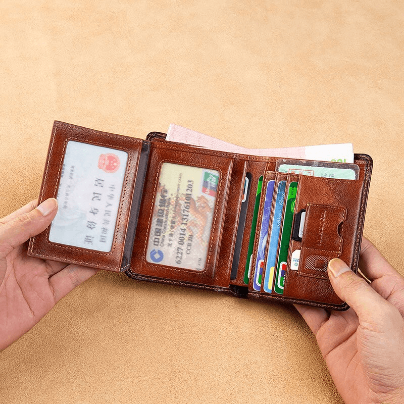 Open genuine leather wallet showcasing card slots and ID holder, perfect for style and organization.