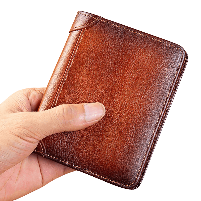 Genuine leather wallet held in hand, showcasing its rich brown color and premium craftsmanship.