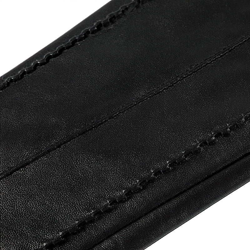 Close-up of black genuine sheepskin leather women's long gloves, showcasing vintage stitching and high-quality material.