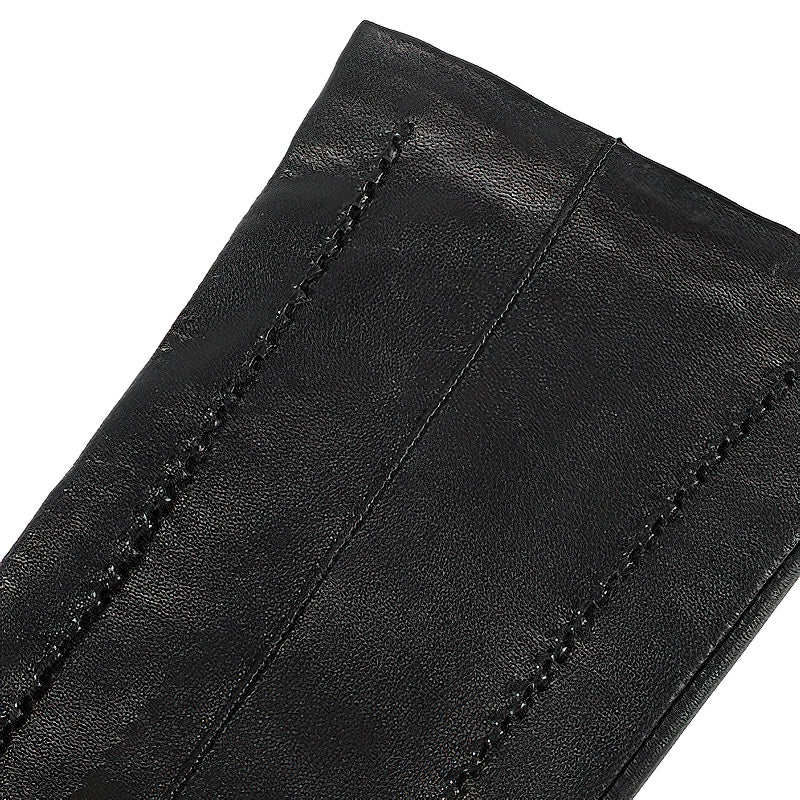 Close-up of genuine leather black sheepskin women's long glove showcasing fine stitching and vintage style.