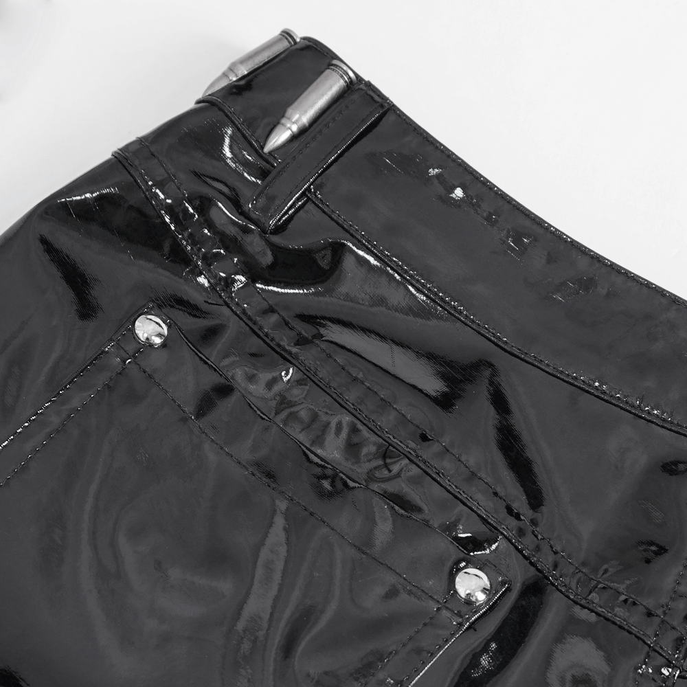 Close-up of glossy black shorts featuring shiny finish and punk rock-inspired chain details.
