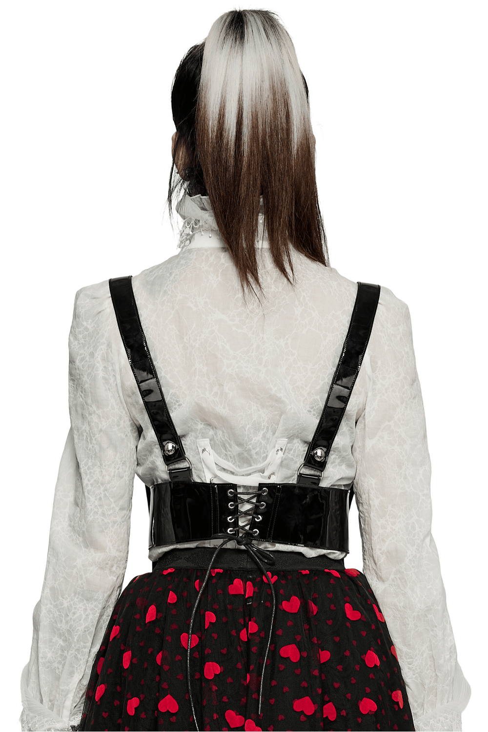 Back view of a model wearing a glossy PU leather corset belt over a lace blouse, complemented by a heart-patterned skirt.