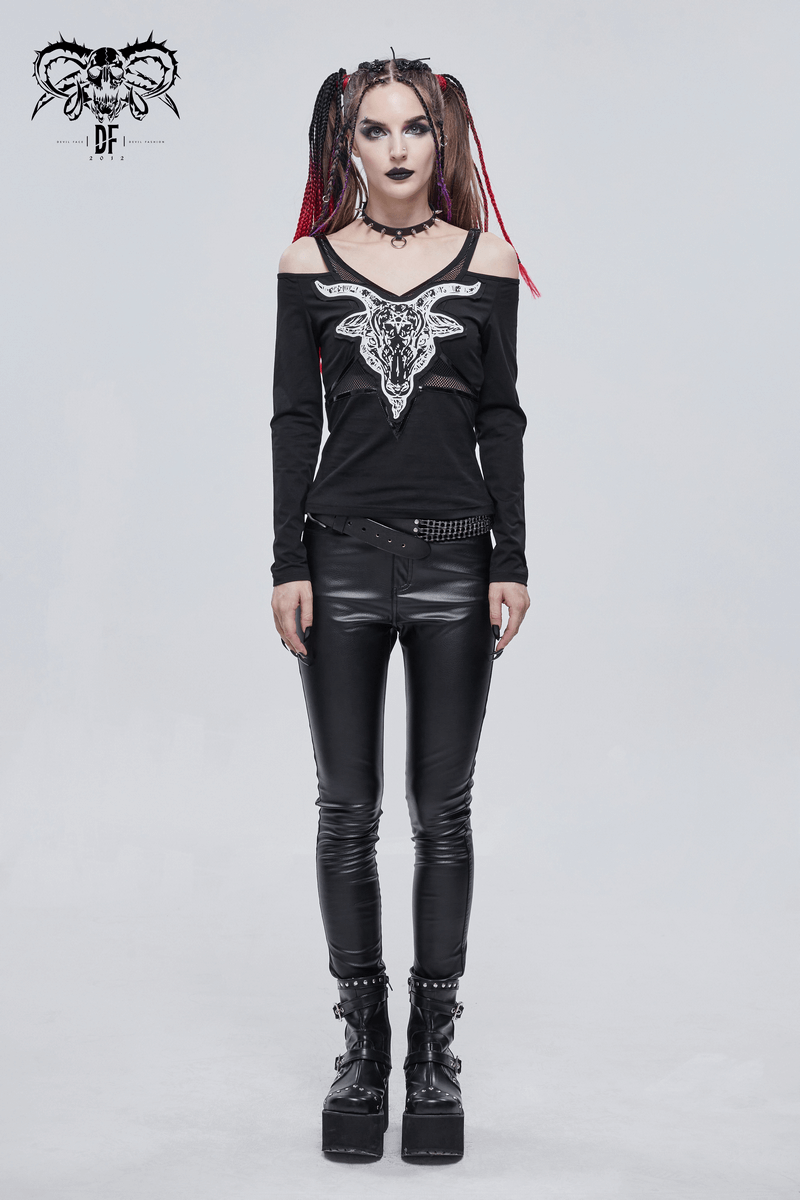 Women in a black Gothic top with goat skull design, paired with shiny black leggings and platform boots.