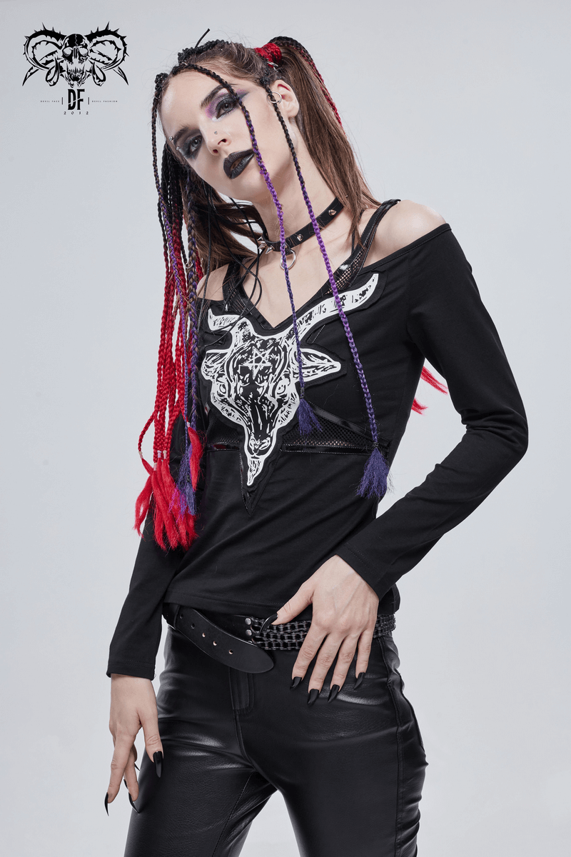 Woman wearing a gothic style black top with goat skull design, showcasing edgy fashion and trendy cut-out shoulders.