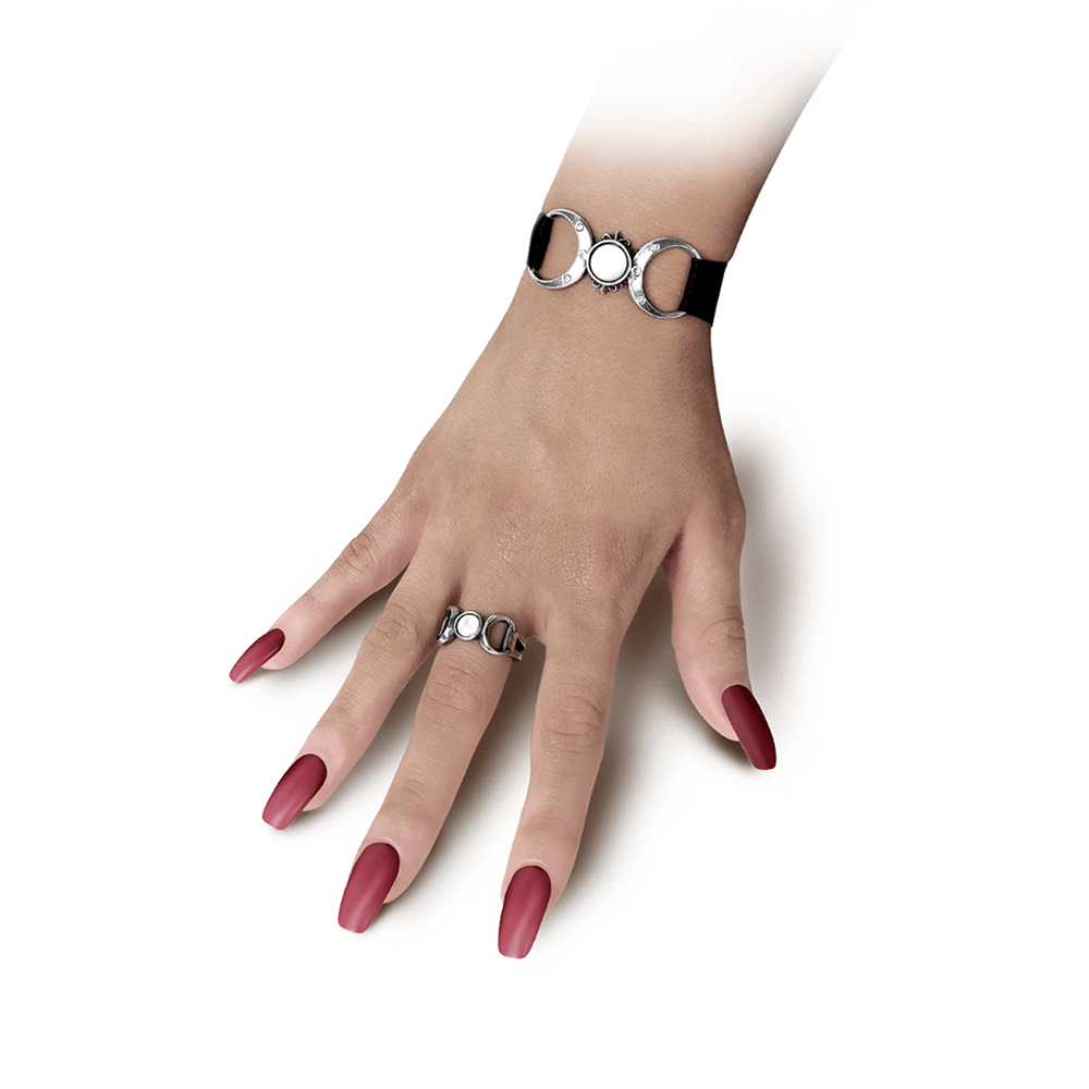 Hand adorned with Goddess Ring and matching bracelet, featuring mother of pearl and Austrian crystals in moon phases design.