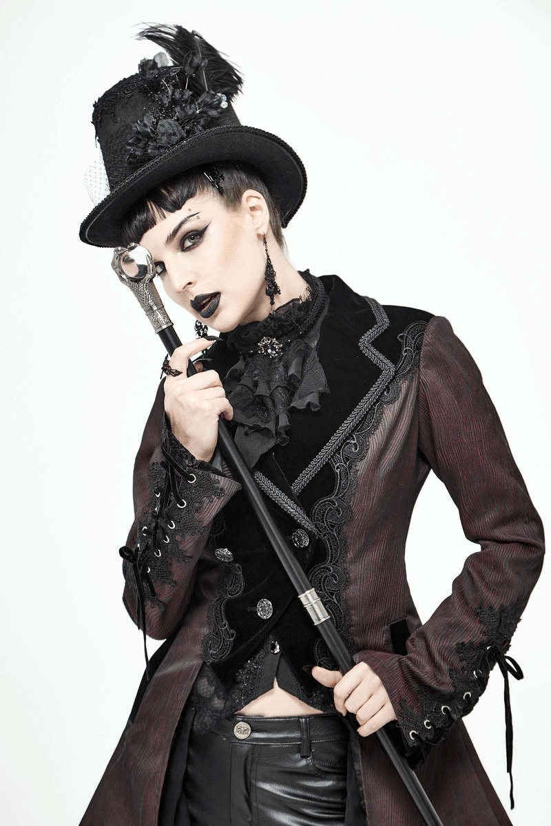 Stylish woman in a vintage gothic coat and top hat, holding a cane, exuding elegance and dark fashion.