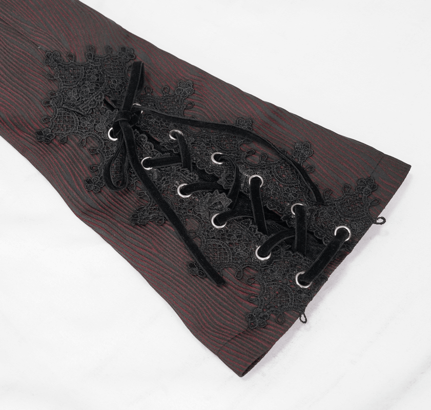 Close-up of vintage gothic coat sleeve featuring intricate lace details and stylish lace-up design.