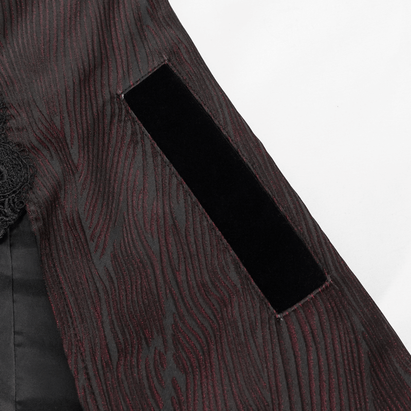 Close-up of the textured fabric and velvet patch on the sleeve of a vintage gothic coat.