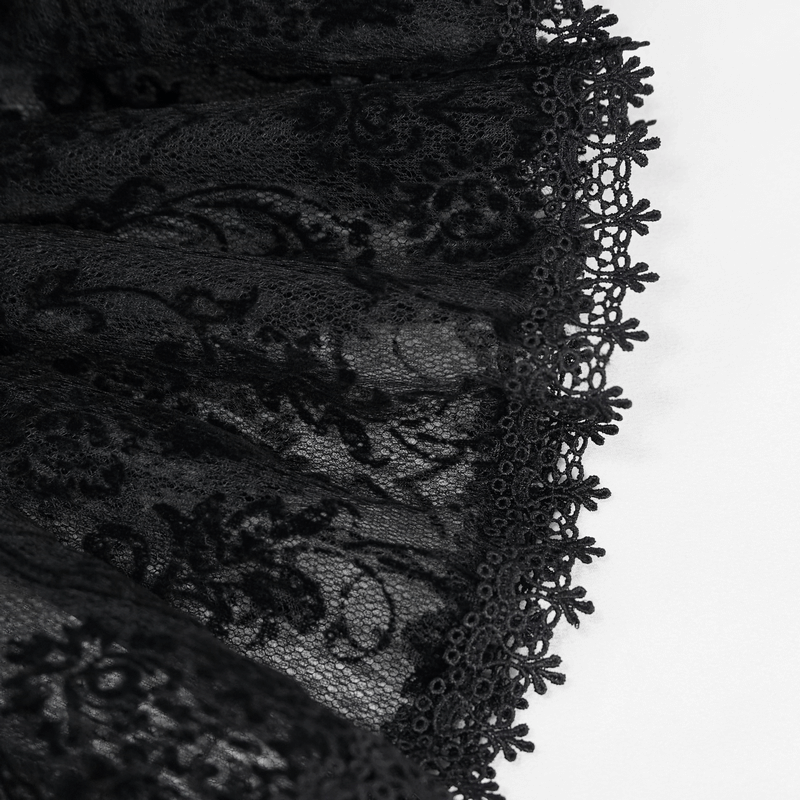 Close-up of exquisite black lace fabric featuring intricate floral patterns and delicate edges.