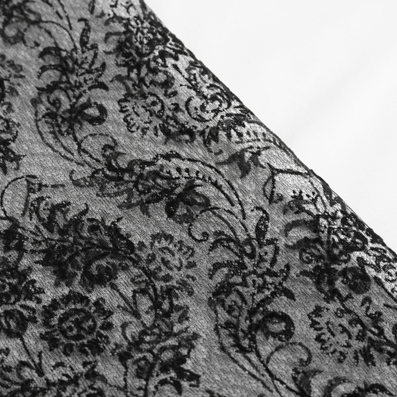 Close-up of exquisite black lace fabric featuring intricate floral patterns for gothic men's shirt.