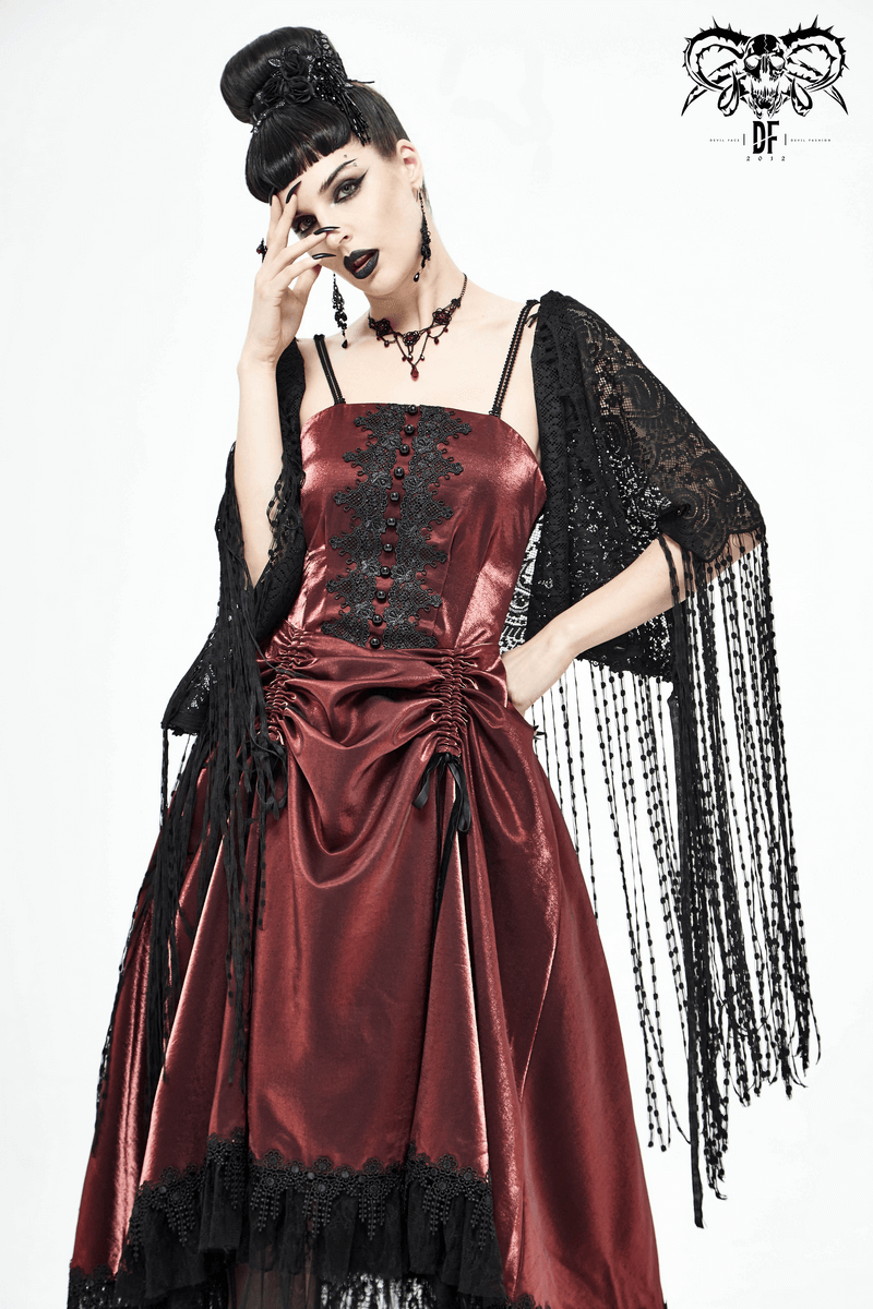 Gothic model showcasing a black lace tassel cape over a burgundy satin dress, embodying elegance and vintage charm.