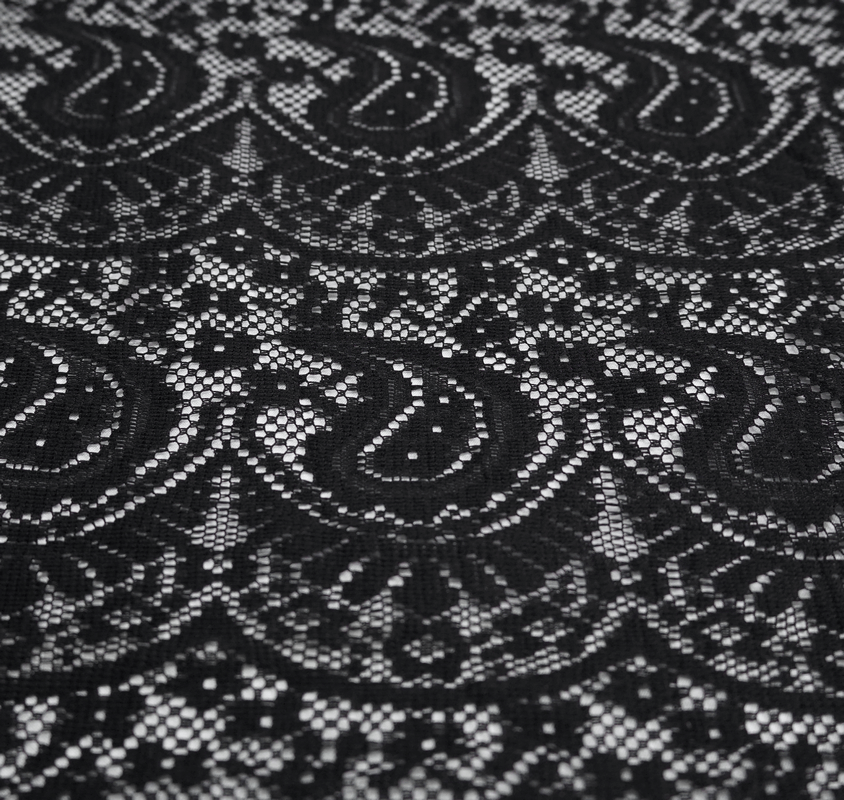 Close-up of elegant black lace fabric with intricate patterns, perfect for a gothic cape or vintage style outfit.