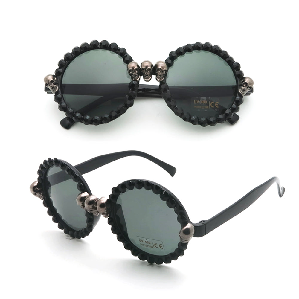 Gorgeous women's black skull rhinestone cat-eye sunglasses with round lenses and stylish skull accents.