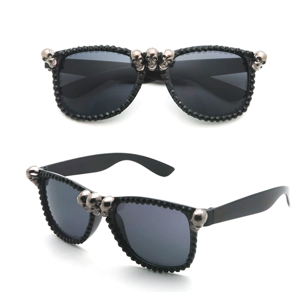 Gorgeous women's black cat-eye sunglasses with skull rhinestones for a trendy gothic look.