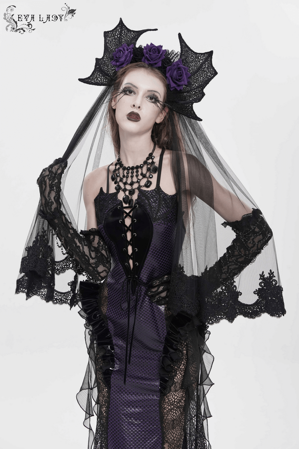 Goth Bat Wing Lace Veil Headpiece with Purple Roses worn by model with gothic makeup and attire.