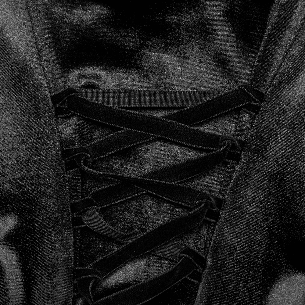 Close-up of the lace-up detail on a gothic black velvet dress, showcasing luxurious texture and design.