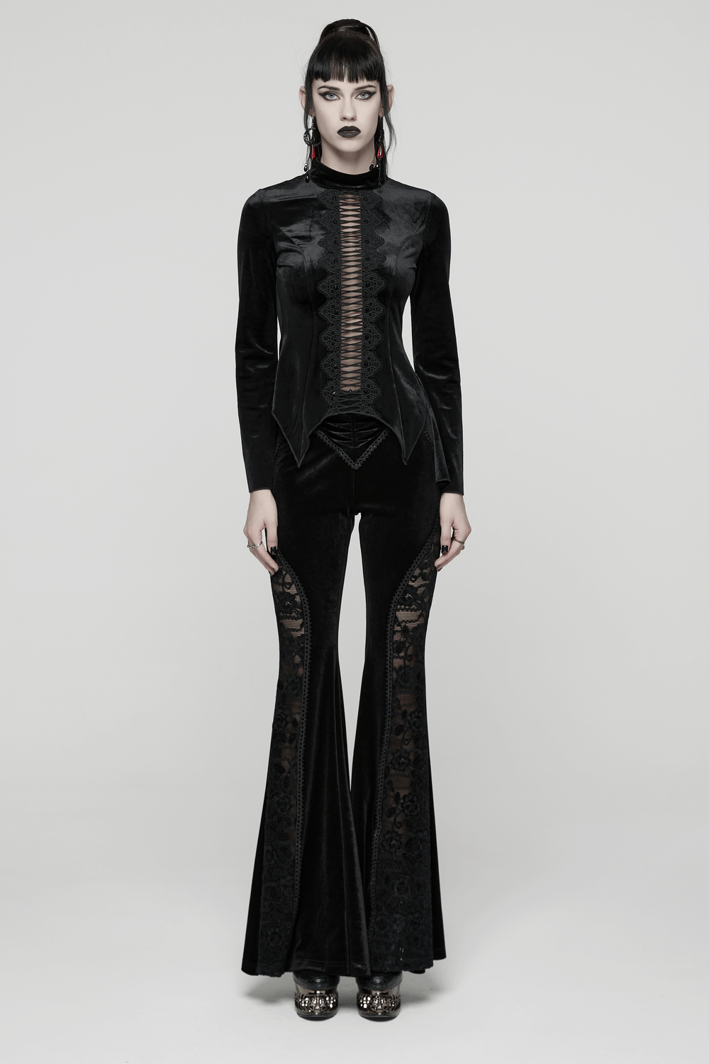Goth Black Velvet Flared Pants with Lace Inserts worn by a model, showcasing elegant style and gothic flair.