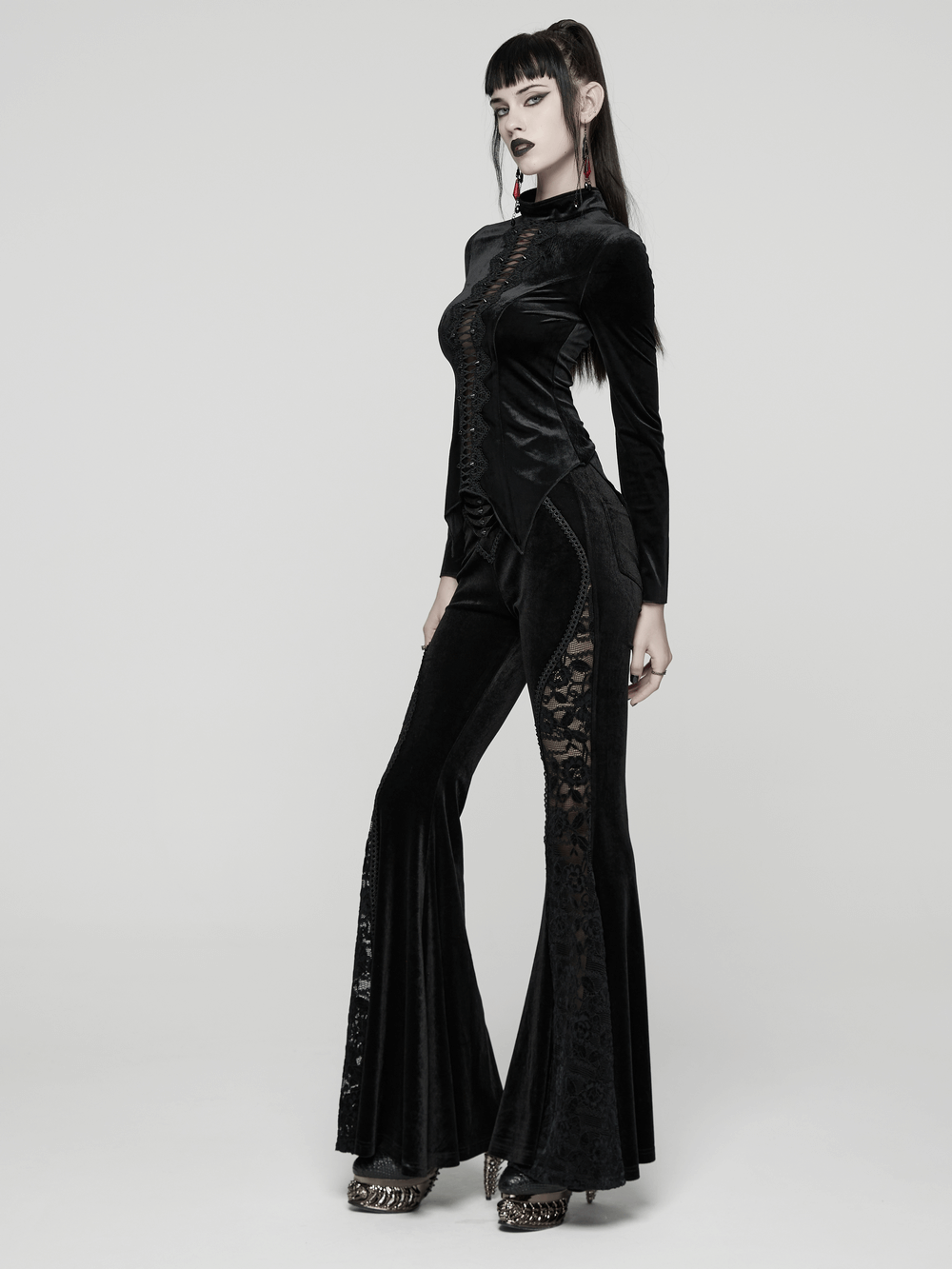Goth Black Velvet Flared Pants with Lace Inserts styled elegantly with a fitted top, showcasing gothic fashion.