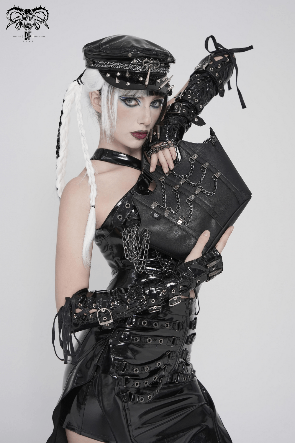 Goth Chain Shoulder Bag with Crown Silhouette Design worn by model in edgy black outfit with chains.