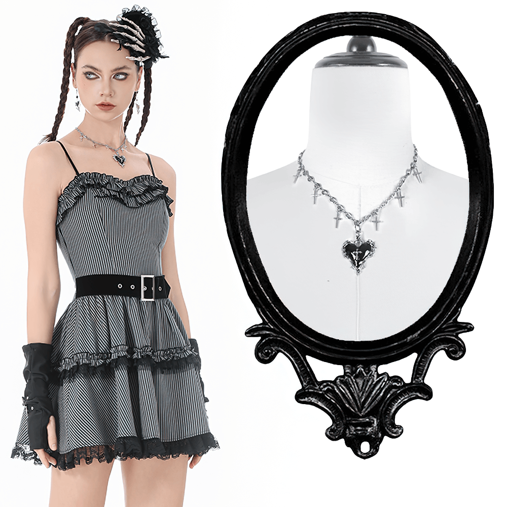 Goth Cross Charm Chain Necklace with Black Heart Pendant showcased with a stylish striped dress and a chic mannequin display.